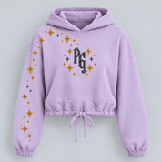 Create Your Light women's lilac cropped hoodie, front digital mockup with black glitter PG monogram and curved star trail across shoulder and sleeve.