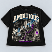 No Ceiling women's black heavyweight boxy tee, front digital mockup with distressed Ambitious lettering, city skyline and hooded stair climber.